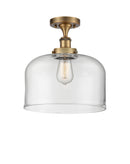 Bell Semi-Flush Mount shown in the Brushed Brass finish with a Clear shade