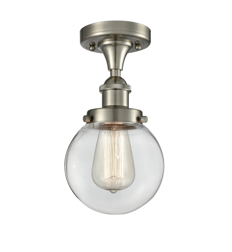 Beacon Flush Mount shown in the Brushed Satin Nickel finish with a Clear shade