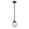 Beacon Mini Pendant shown in the Black Antique Brass finish with a Seedy shade