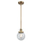 Beacon Mini Pendant shown in the Brushed Brass finish with a Seedy shade