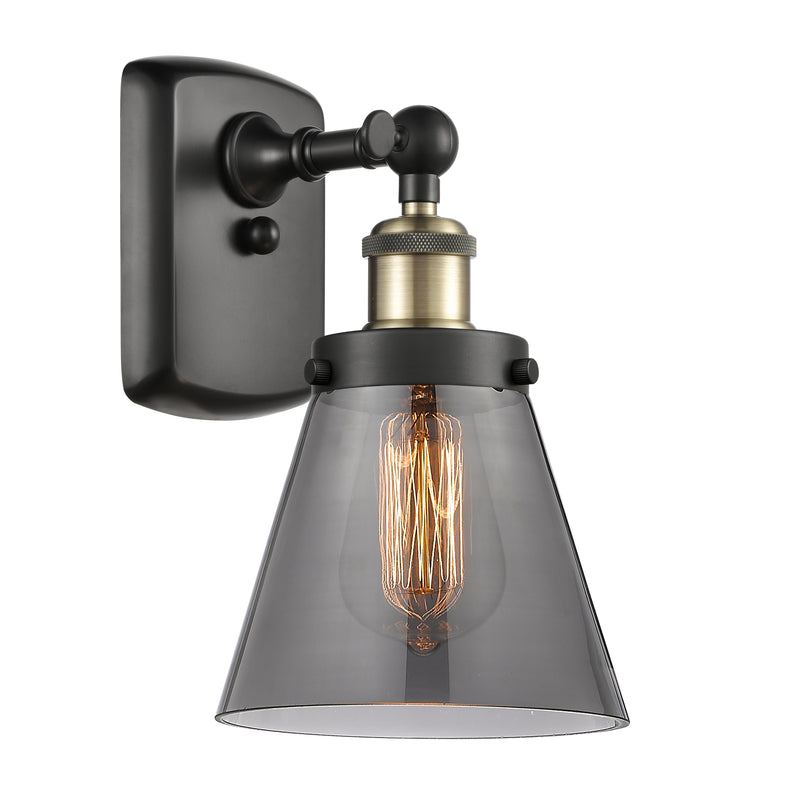 Cone Sconce shown in the Black Antique Brass finish with a Plated Smoke shade