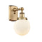 Beacon Sconce shown in the Brushed Brass finish with a Matte White shade