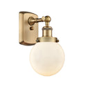 Beacon Sconce shown in the Brushed Brass finish with a Matte White shade