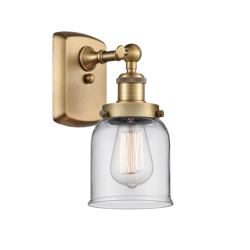 Bell Sconce shown in the Brushed Brass finish with a Clear shade