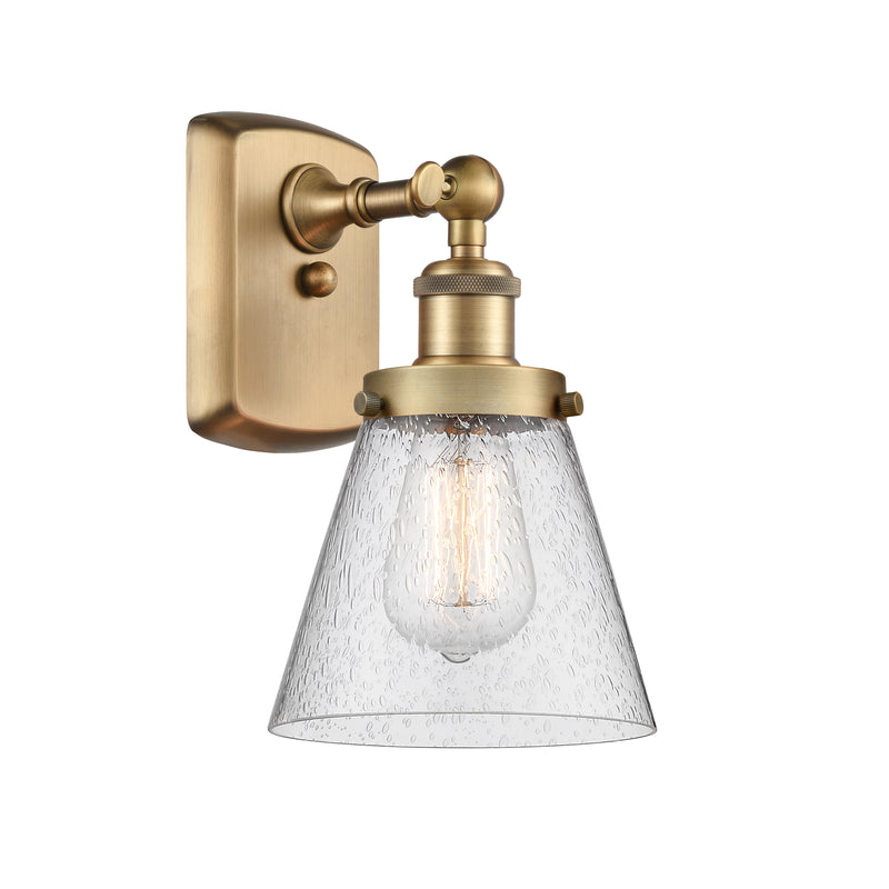 Cone Sconce shown in the Brushed Brass finish with a Seedy shade