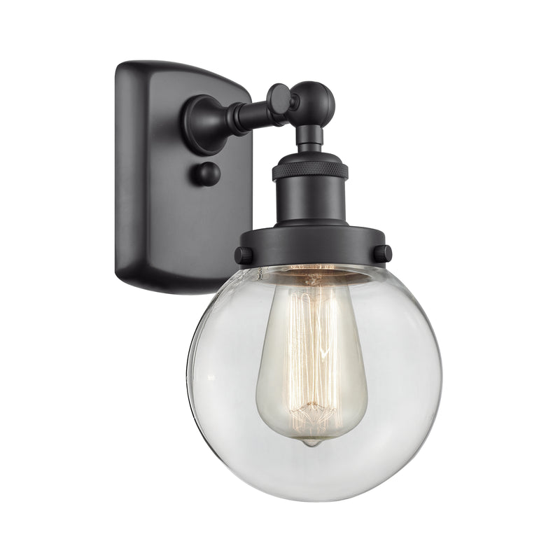 Beacon Sconce shown in the Matte Black finish with a Clear shade