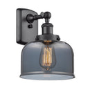 Bell Sconce shown in the Matte Black finish with a Plated Smoke shade