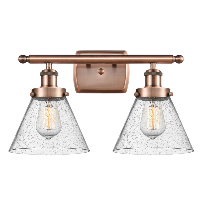 Cone Bath Vanity Light shown in the Antique Copper finish with a Seedy shade