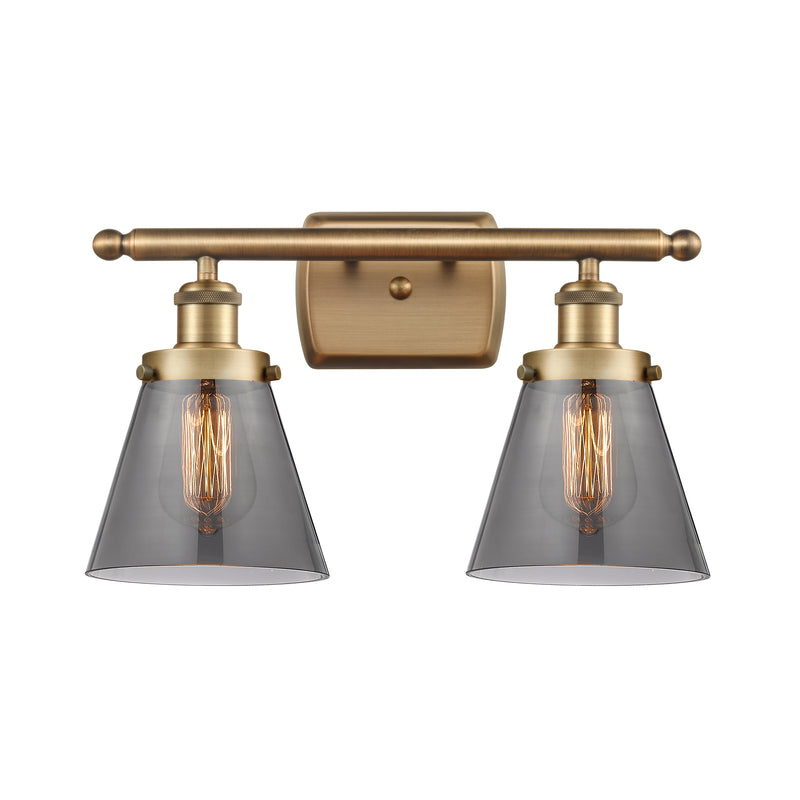 Cone Bath Vanity Light shown in the Brushed Brass finish with a Plated Smoke shade