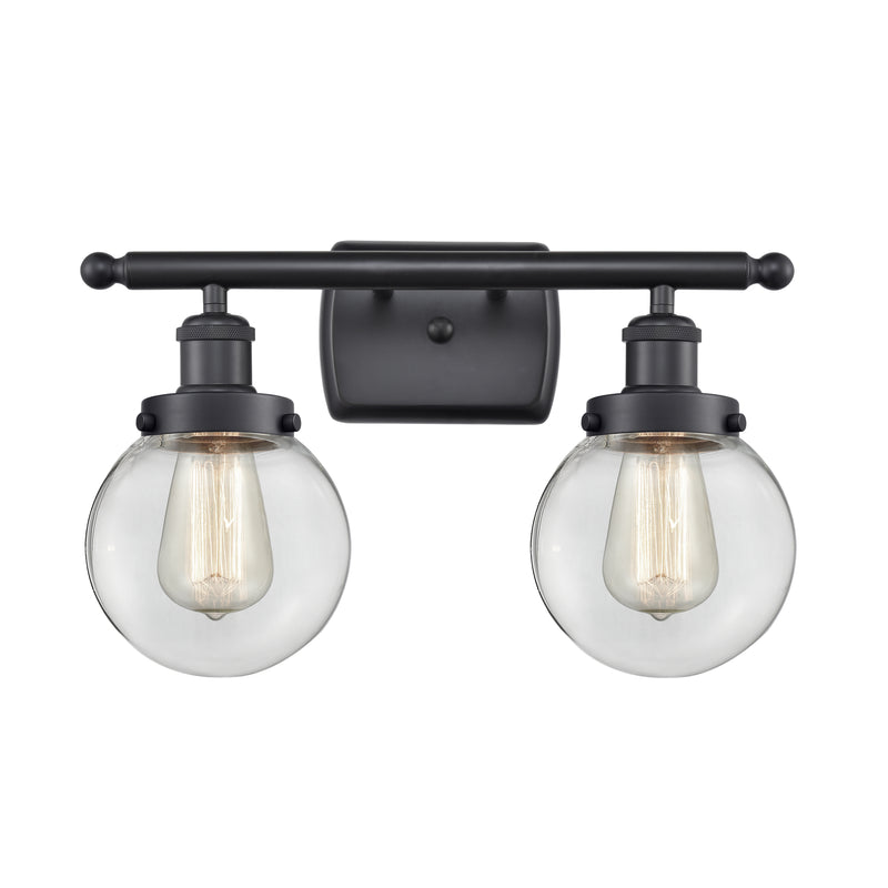 Beacon Bath Vanity Light shown in the Matte Black finish with a Clear shade