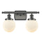 Beacon Bath Vanity Light shown in the Oil Rubbed Bronze finish with a Matte White shade