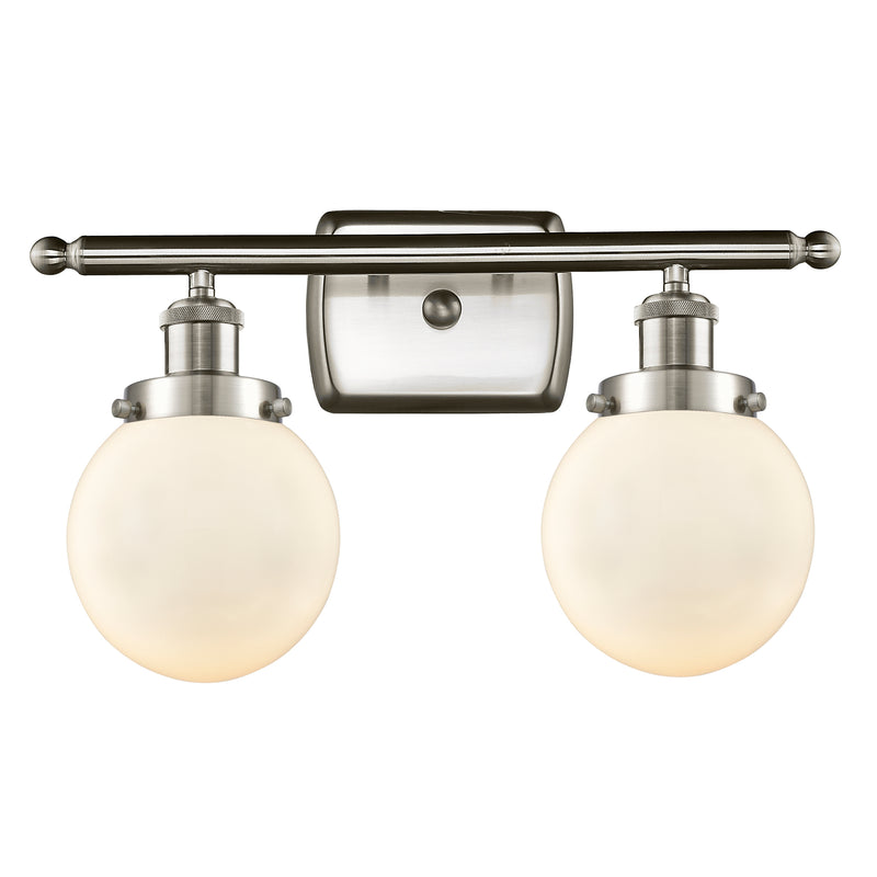 Beacon Bath Vanity Light shown in the Brushed Satin Nickel finish with a Matte White shade