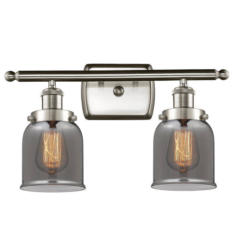 Bell Bath Vanity Light shown in the Brushed Satin Nickel finish with a Plated Smoke shade