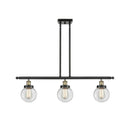 Beacon Island Light shown in the Black Antique Brass finish with a Clear shade