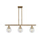 Beacon Island Light shown in the Brushed Brass finish with a Clear shade