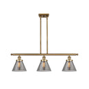 Cone Island Light shown in the Brushed Brass finish with a Plated Smoke shade