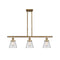 Cone Island Light shown in the Brushed Brass finish with a Clear shade