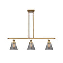 Cone Island Light shown in the Brushed Brass finish with a Plated Smoke shade