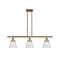 Cone Island Light shown in the Brushed Brass finish with a Seedy shade