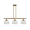 Bell Island Light shown in the Brushed Brass finish with a Clear shade