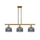 Bell Island Light shown in the Brushed Brass finish with a Plated Smoke shade