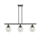 Beacon Island Light shown in the Matte Black finish with a Clear shade