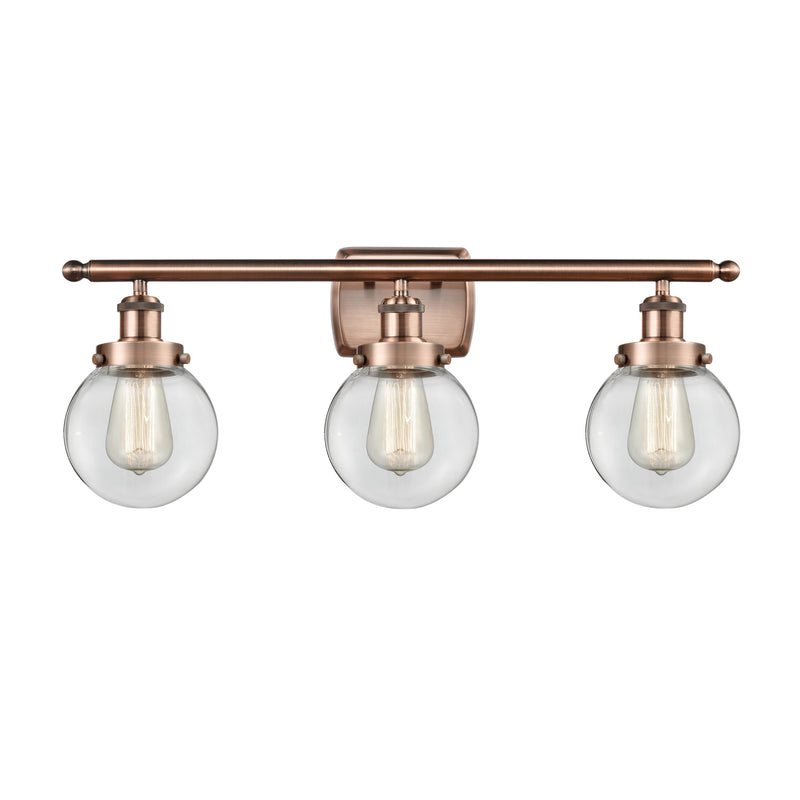 Beacon Bath Vanity Light shown in the Antique Copper finish with a Clear shade