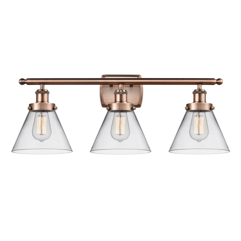 Cone Bath Vanity Light shown in the Antique Copper finish with a Clear shade