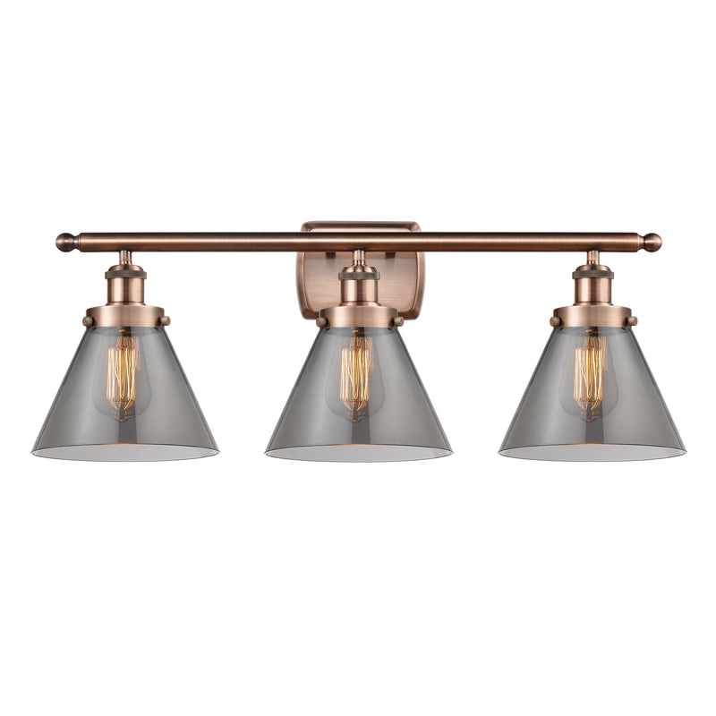 Cone Bath Vanity Light shown in the Antique Copper finish with a Plated Smoke shade