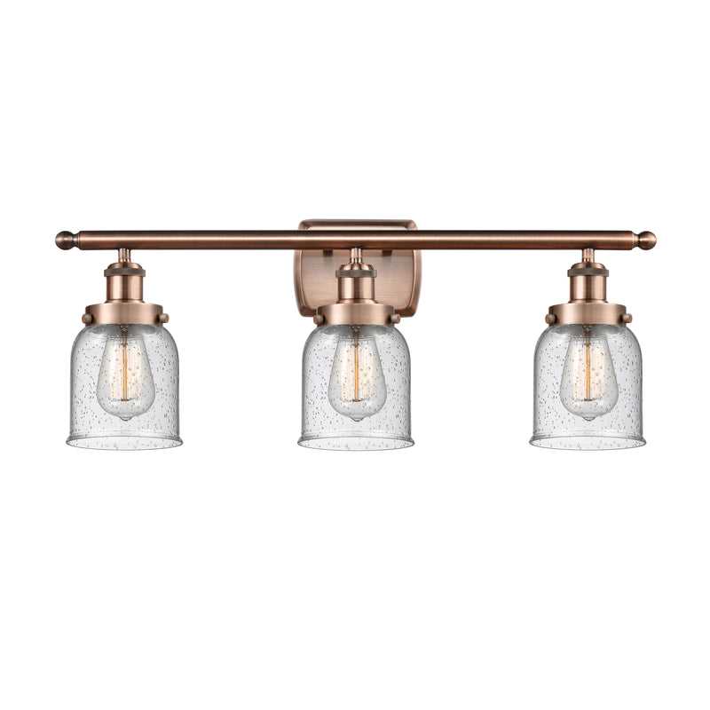 Bell Bath Vanity Light shown in the Antique Copper finish with a Seedy shade