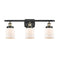 Bell Bath Vanity Light shown in the Black Antique Brass finish with a Matte White shade