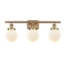 Beacon Bath Vanity Light shown in the Brushed Brass finish with a Matte White shade