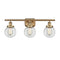 Beacon Bath Vanity Light shown in the Brushed Brass finish with a Clear shade