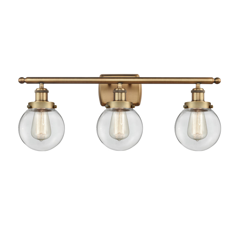 Beacon Bath Vanity Light shown in the Brushed Brass finish with a Clear shade