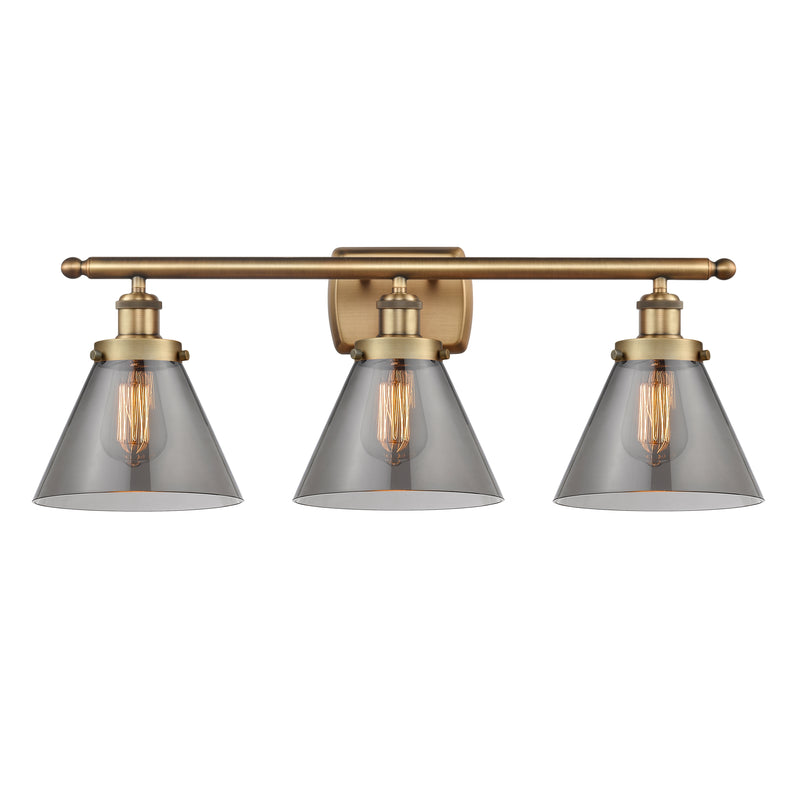 Cone Bath Vanity Light shown in the Brushed Brass finish with a Plated Smoke shade