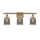 Bell Bath Vanity Light shown in the Brushed Brass finish with a Plated Smoke shade