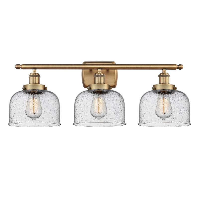 Bell Bath Vanity Light shown in the Brushed Brass finish with a Seedy shade