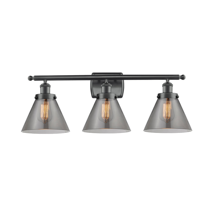 Cone Bath Vanity Light shown in the Matte Black finish with a Plated Smoke shade