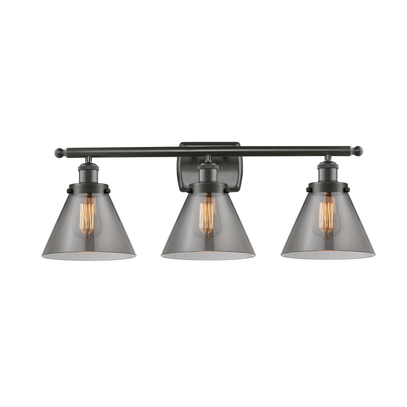 Cone Bath Vanity Light shown in the Oil Rubbed Bronze finish with a Plated Smoke shade