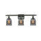 Bell Bath Vanity Light shown in the Oil Rubbed Bronze finish with a Plated Smoke shade