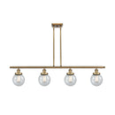 Beacon Island Light shown in the Brushed Brass finish with a Seedy shade