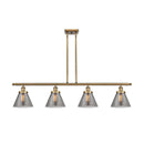 Cone Island Light shown in the Brushed Brass finish with a Plated Smoke shade