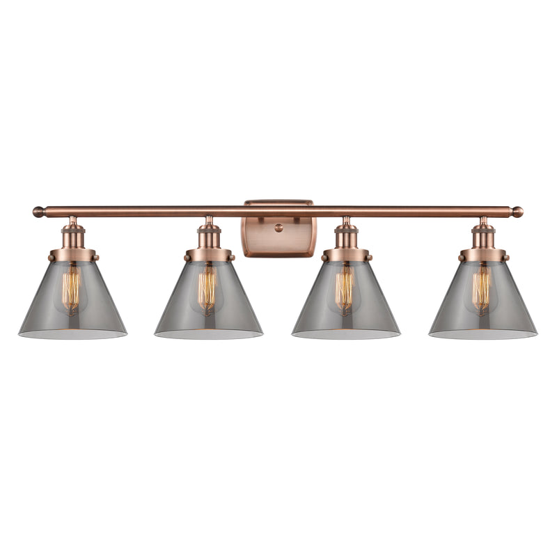 Cone Bath Vanity Light shown in the Antique Copper finish with a Plated Smoke shade