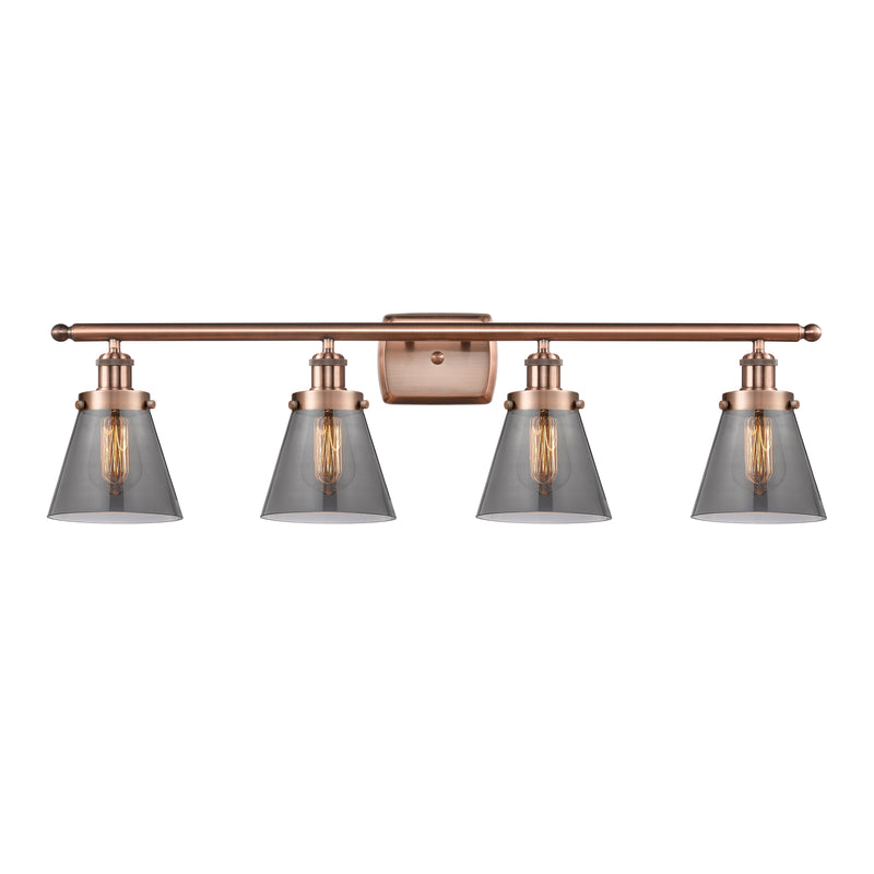 Cone Bath Vanity Light shown in the Antique Copper finish with a Plated Smoke shade