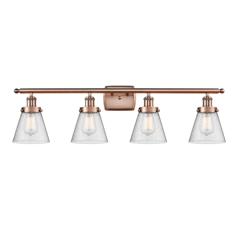 Cone Bath Vanity Light shown in the Antique Copper finish with a Seedy shade