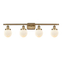 Beacon Bath Vanity Light shown in the Brushed Brass finish with a Matte White shade