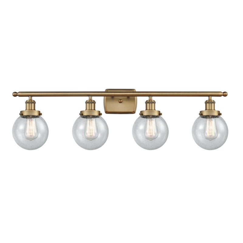 Beacon Bath Vanity Light shown in the Brushed Brass finish with a Seedy shade