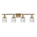 Bell Bath Vanity Light shown in the Brushed Brass finish with a Seedy shade