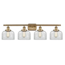 Bell Bath Vanity Light shown in the Brushed Brass finish with a Clear shade