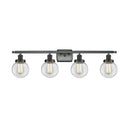 Beacon Bath Vanity Light shown in the Matte Black finish with a Clear shade